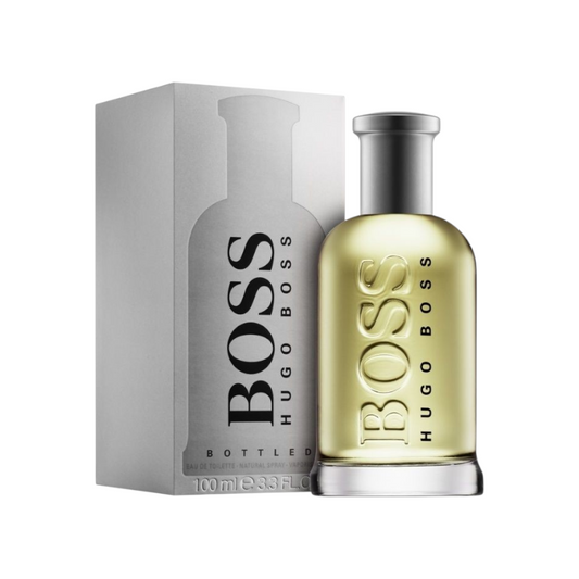 Frasco de perfume Boss Bottled de Hugo Boss junto a su caja plateada, disponible en KingParfumCol