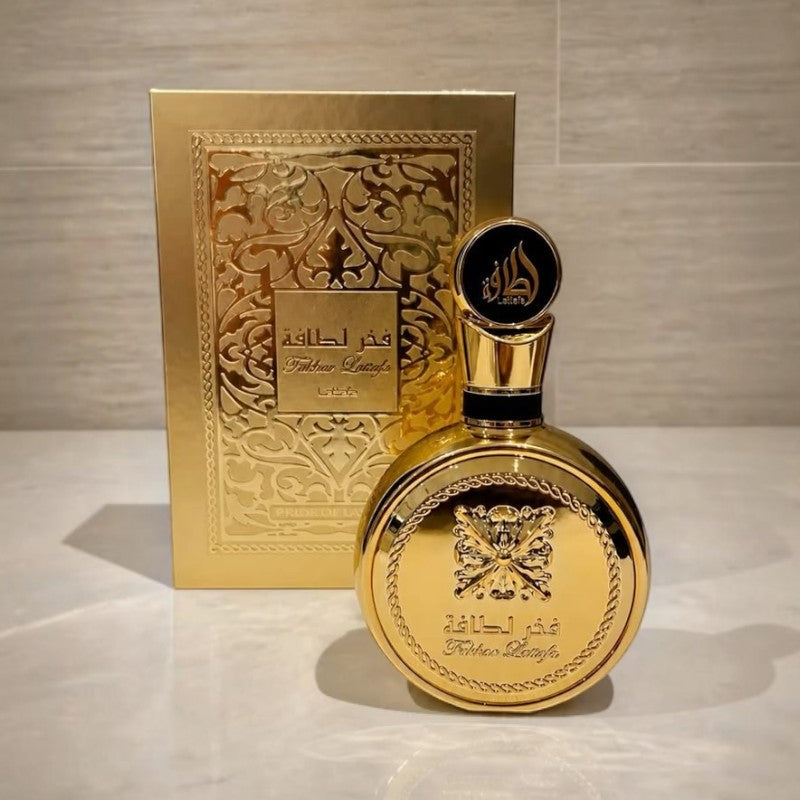 Perfume Fakhar Lattafa Gold de KingParfumCol en frasco redondo dorado con caja decorativa a juego