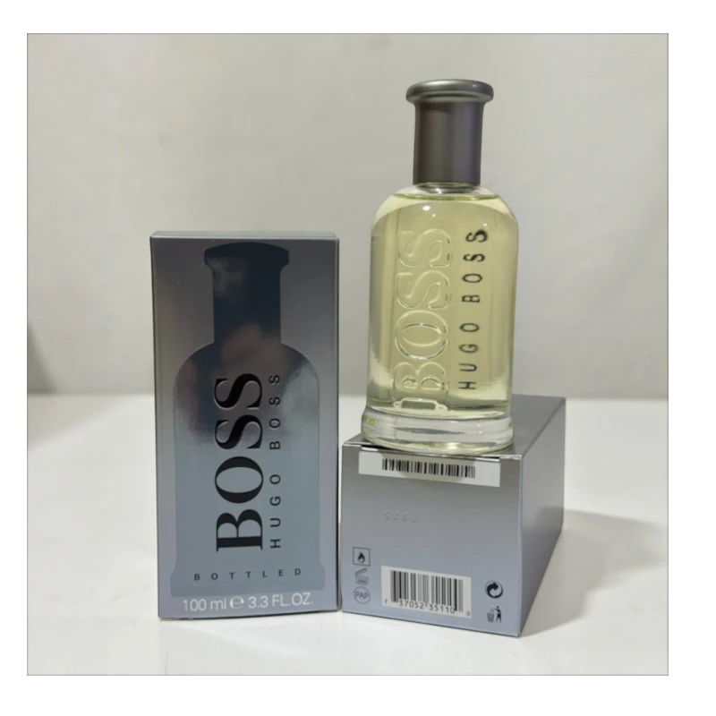 Perfume Hugo Boss Bottled Original de KingParfumCol con frasco de vidrio transparente y caja plateada de 100ml