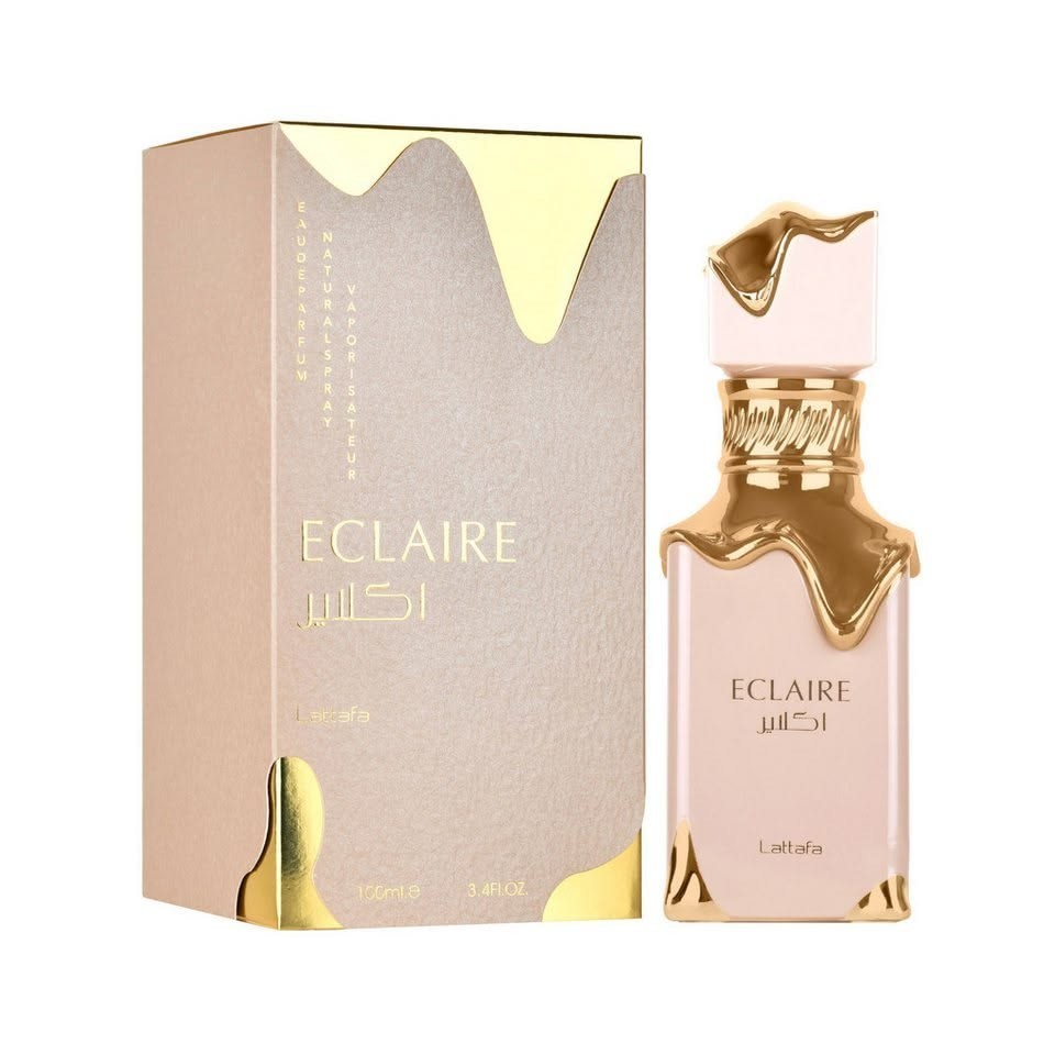 Perfume Eclaire Lattafa de KingParfumCol con frasco y caja en tonos beige y detalles dorados tipo caramelo derretido