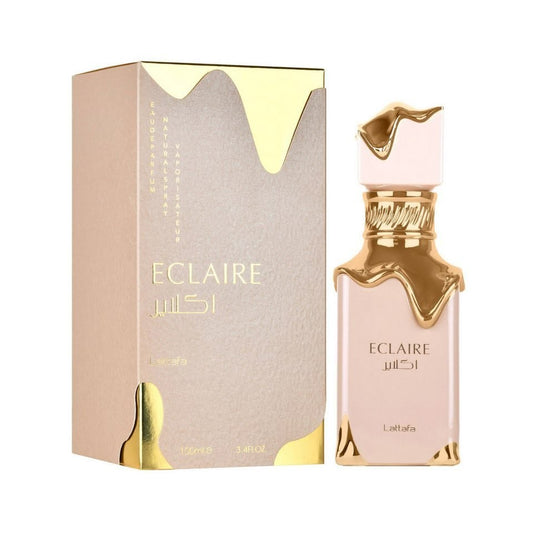 Perfume Eclaire Lattafa de KingParfumCol con frasco y caja en tonos beige y detalles dorados tipo caramelo derretido