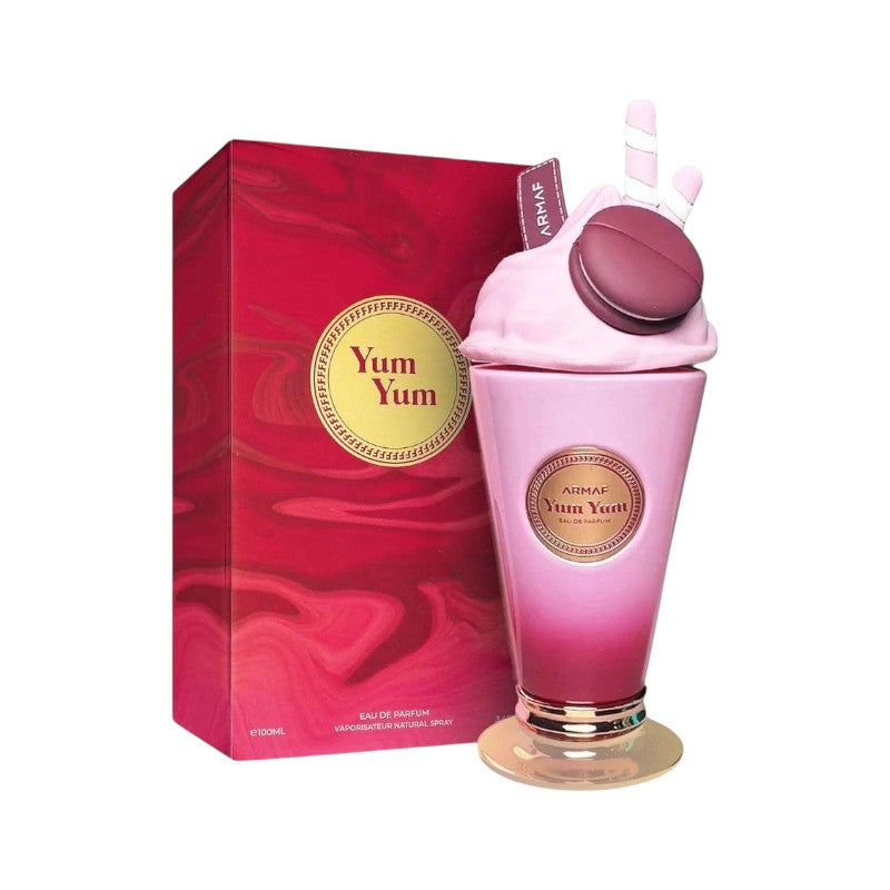 Perfume Yum Yum de KingParfumCol en frasco con forma de helado rosa y caja decorativa con diseño de remolinos rojos